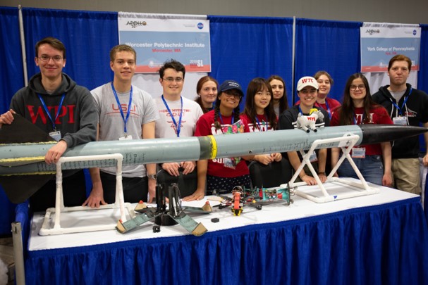 The team presenting their rocket and payload at the NASA SLI rocket fair.