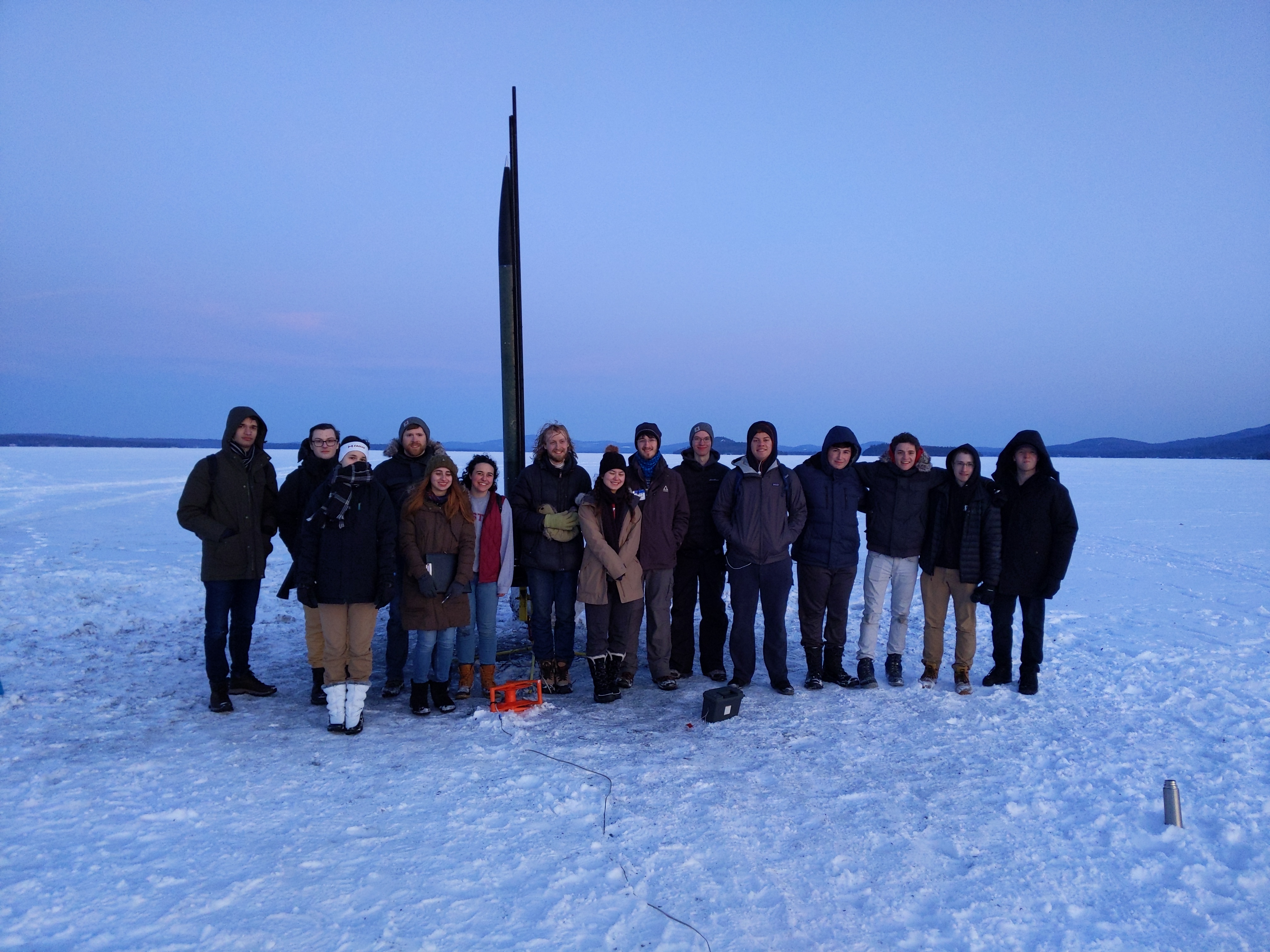 The team takes a group photo right before Phoenix takes flight over Lake Winnipesaukee.